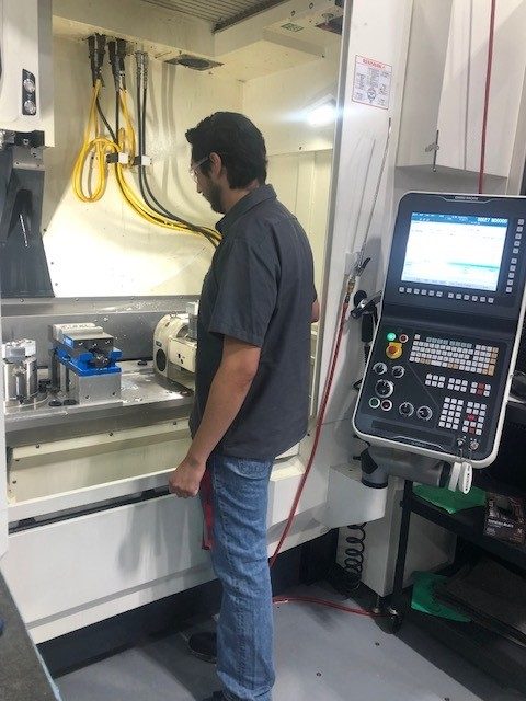 Julio Gutierrez at a machine